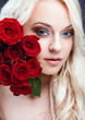 Beautiful girl with red roses
