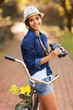 happy woman with binoculars outdoors