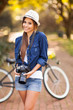 young girl posing with digital camera