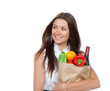 Photo: woman holding a paper shopping bag full of groceries woman holding a paper shopping bag full of groceries