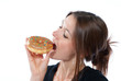 Photo: Woman enjoy chocolate donut cake Woman enjoy chocolate donut cake