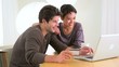 Chinese woman excitedly shopping online with boyfriend
