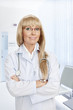 Foto: Portrait of nice doctor on white back Portrait of nice doctor on white back