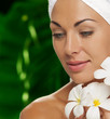 Photo: portrait of young beautiful woman in spa environment portrait of young beautiful woman in spa environment
