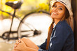 young fashion model sitting outdoors