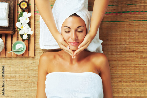 Photo: portrait of young beautiful woman in spa environment. portrait of young beautiful woman in spa environment.