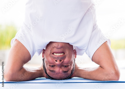 Photo: Man doing yoga exercises Man doing yoga exercises