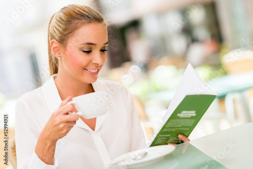 Photo: Business woman drinking coffee Business woman drinking coffee