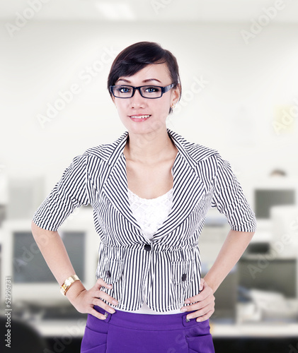 Photo: Beautiful businesswoman pose at office Beautiful businesswoman pose at office