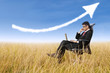 Photo: Businessman sit outdoor with success arrow sign Businessman sit outdoor with success arrow sign