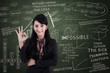Photo: Businesswoman approval gesture in class Businesswoman approval gesture in class