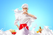 Asian female cook against milk splashes