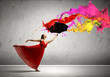 Ballet dancer in flying satin dress with umbrella