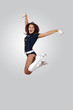 Young female dancer against white background