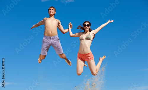 Photo: Happy Young Couple Together On The Beach Happy Young Couple Together On The Beach
