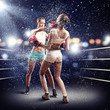 Two women boxing in ring