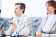Photo: Three businesspeople at meeting Three businesspeople at meeting