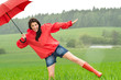 Playful happy girl in the rain