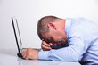 Photo: old business man sleeping on his laptop old business man sleeping on his laptop