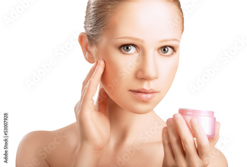 Photo: skin care. beauty healthy girl with jar of cream isolated on wh skin care. beauty healthy girl with jar of cream isolated on wh