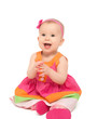 Photo: happy little baby girl in bright multicolored festive dress isol happy little baby girl in bright multicolored festive dress isol
