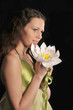 Romantic girl with her long hair with a flower