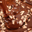 Photo: Pouring hot melted chocolate with sunflower seeds Pouring hot melted chocolate with sunflower seeds