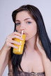 beautiful girl with glass of orange juice