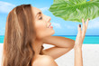 Photo: woman with green leaf woman with green leaf