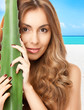 Photo: lovely woman with aloe vera lovely woman with aloe vera