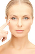 woman pointing at her eye area