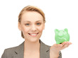 lovely woman with small piggy bank