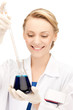 Foto: female chemist holding bulb with chemicals female chemist holding bulb with chemicals