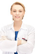 Photo: smiling female doctor in uniform smiling female doctor in uniform
