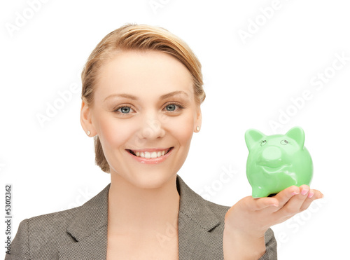 Photo: lovely woman with small piggy bank lovely woman with small piggy bank