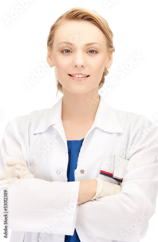 Photo: smiling female doctor in uniform smiling female doctor in uniform