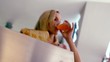 Woman waiting for her toast to pop