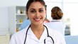 Video: Doctor standing and smiling in front of medical team Doctor standing and smiling in front of medical team