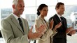 Business team clapping in office