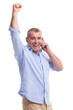 casual middle aged man on phone and cheering