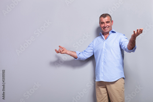 Photo: casual old man welcomes you casual old man welcomes you