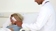 Doctor reading a document to a patient