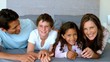 Family lying on a bed