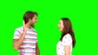 Friends giving high-five on green screen
