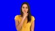 Woman asking for silence on blue screen