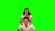 Woman jumping on the back of her friend
