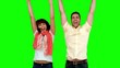 Two friends jumping on green screen