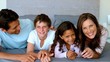 Family lying on a bed
