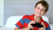 Video: Concentrated young boy playing video games Concentrated young boy playing video games