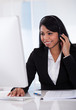 Female Customer Representative Using Computer
